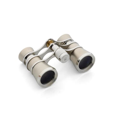 Rolex. A set of stainless steel event binoculars .